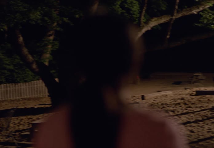 The girl exits the room to the playground outside
