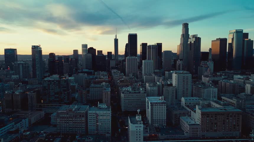 An aerial view of the city coming to life as the sun rises
