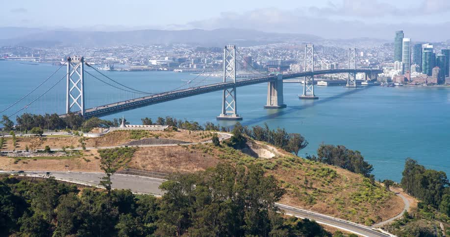 Traffic flows over the bridge towards the city