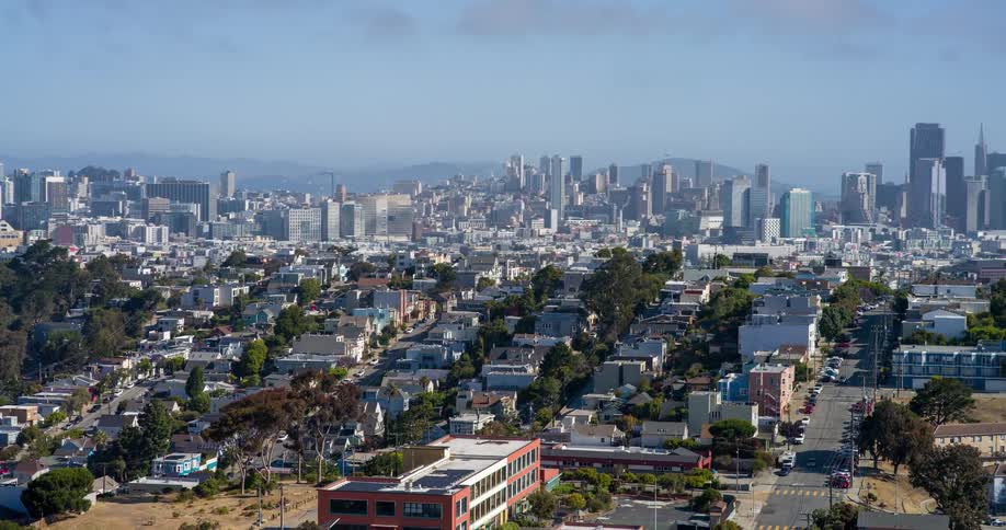 Aerial view of an urban area with skyscrapers on the horizon