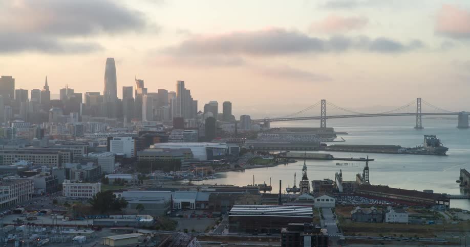Panoramic view of a seaside metropolis and a bridge in the background