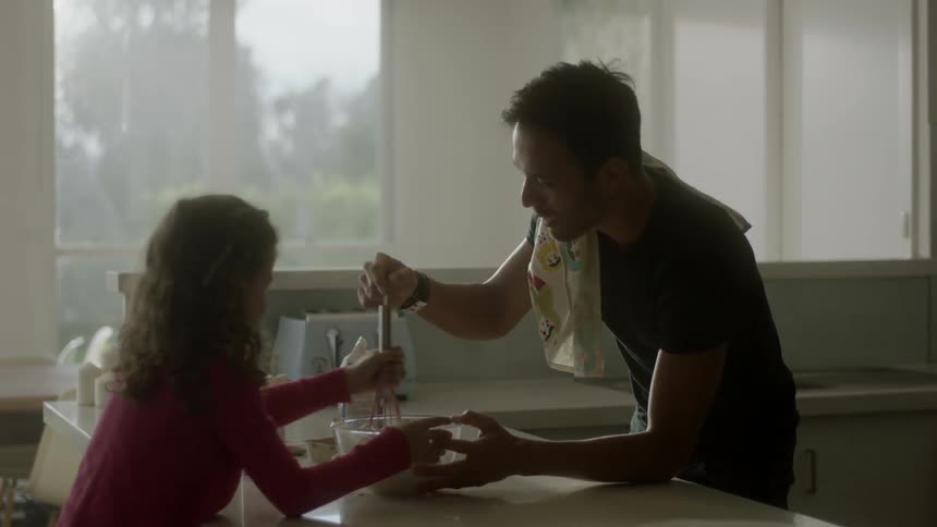 Man and girl stirring a bowl