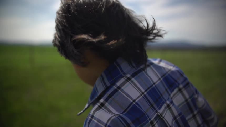 A person's hair blowing in the wind