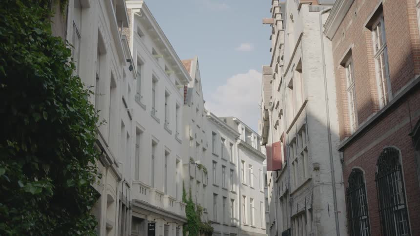 A city street is lined with buildings