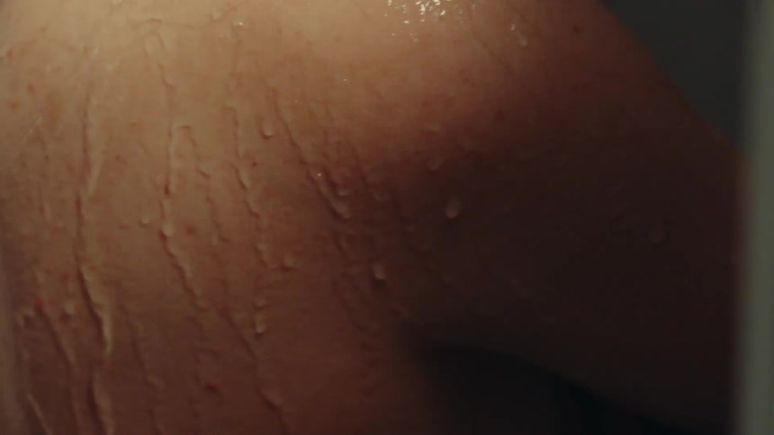A woman is showering at home