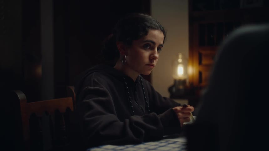 A girl is having dinner at home
