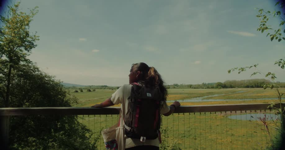 Woman with a backpack enjoying the natural landscape