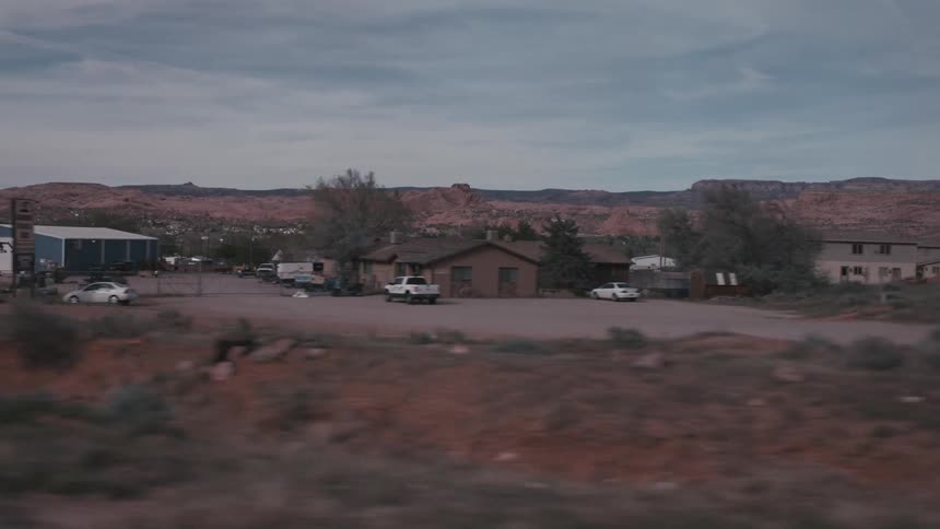 Driving past a small desert town