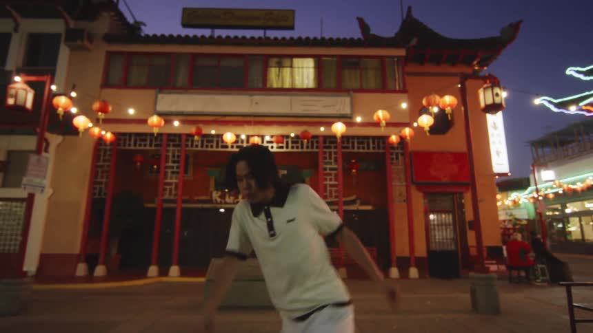 A man is dancing in the town square