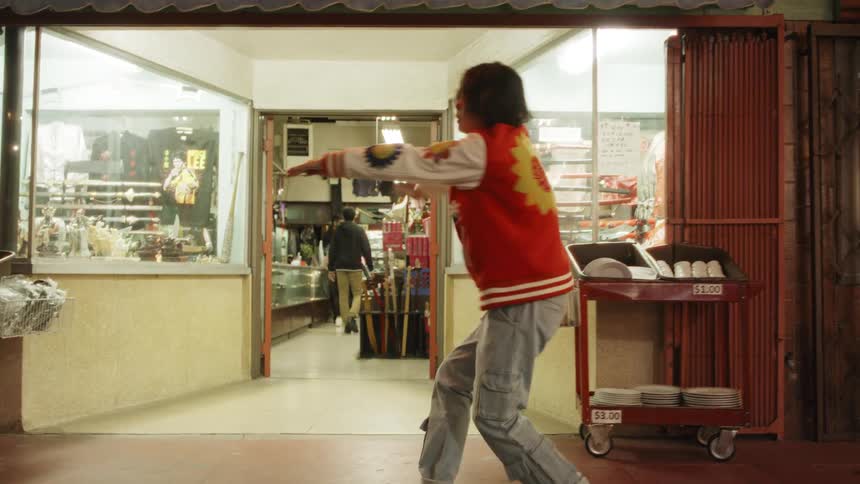 Young dancer performing on an urban street at night