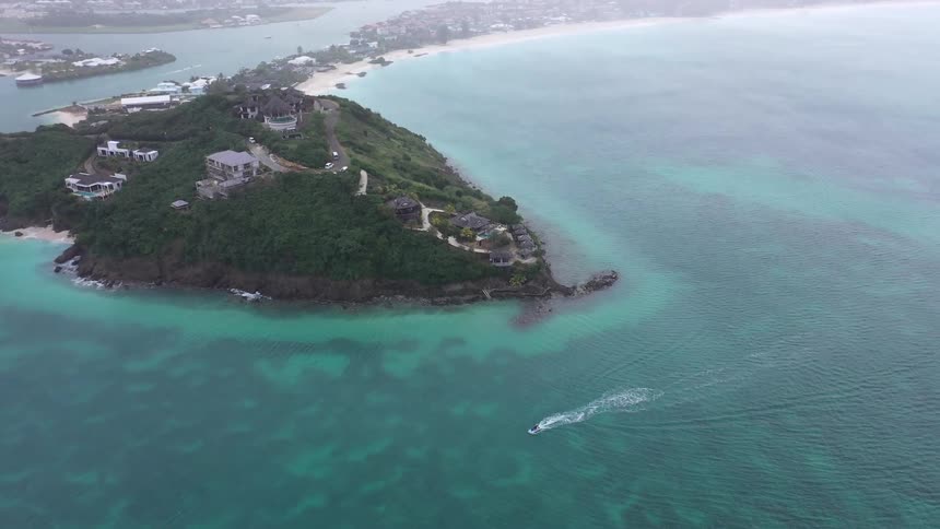 Aerial landscape of an archipelago with turquoise blue sea and coastline with buildings
