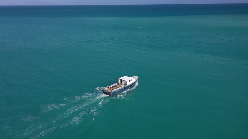 A boat sailing on the ocean