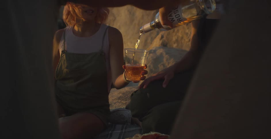 Group of friends outdoors serving wine