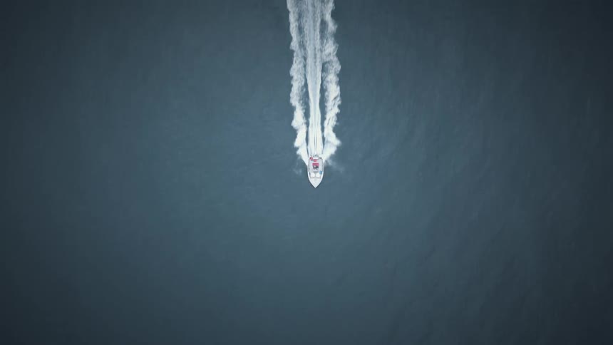 The speed boat travels in the ocean