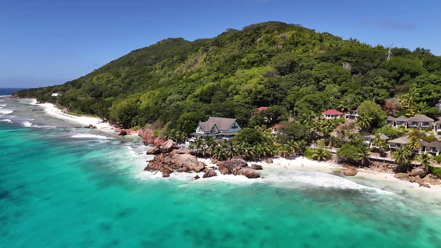 Aerial view of an island with some houses by the sea