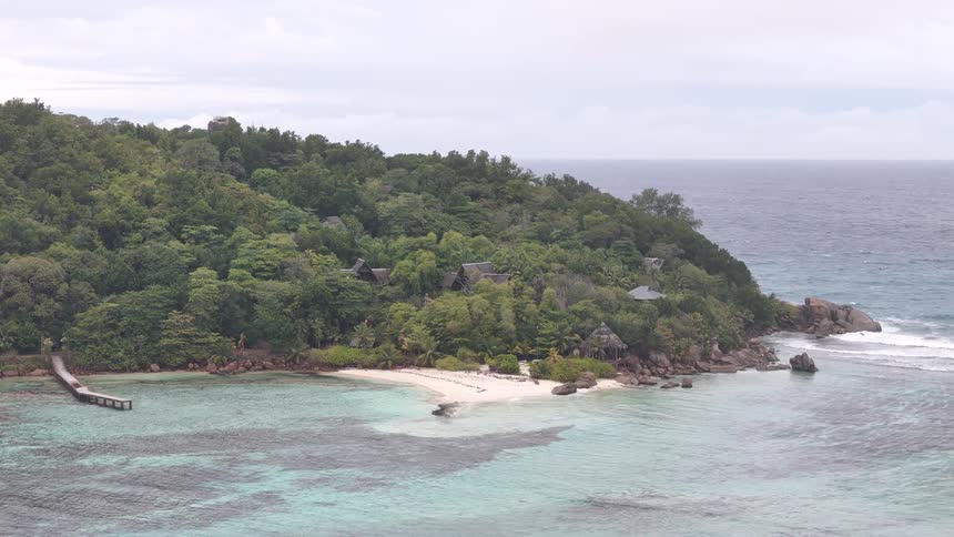 Aerial panorama of an island with a blue sea