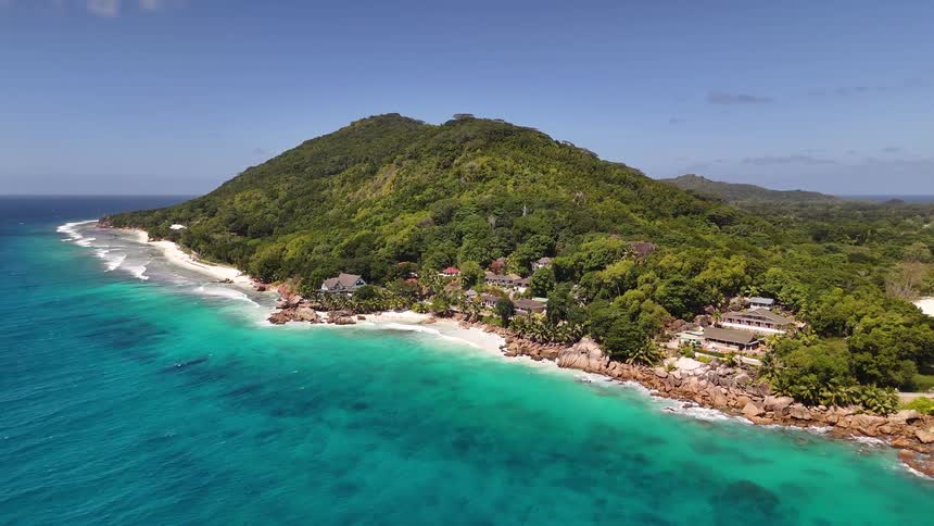 Resorts line the shore of the tropical island