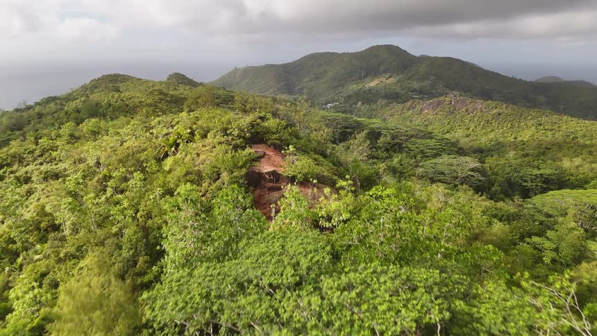 A mountainous highland covered in green vegetation on a cloudy day