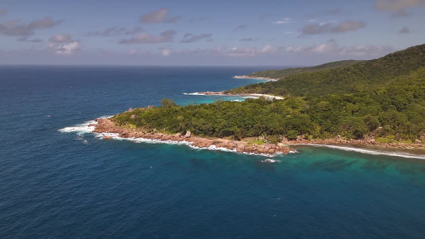 Green wooded mountains by the sea