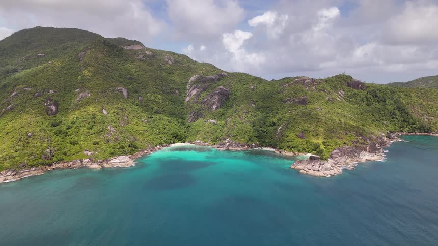 The island is covered in mountains and trees
