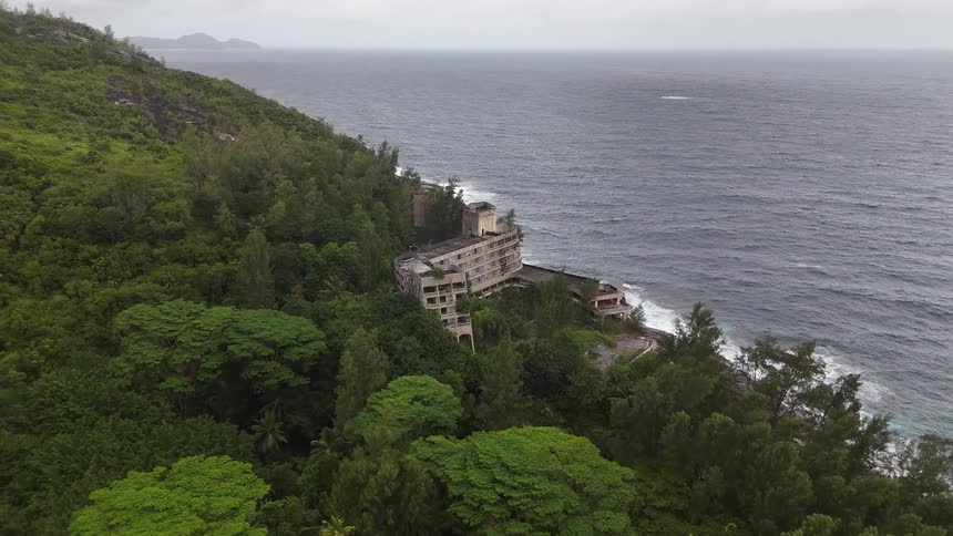 Abandoned building on a wooded mountain by the sea