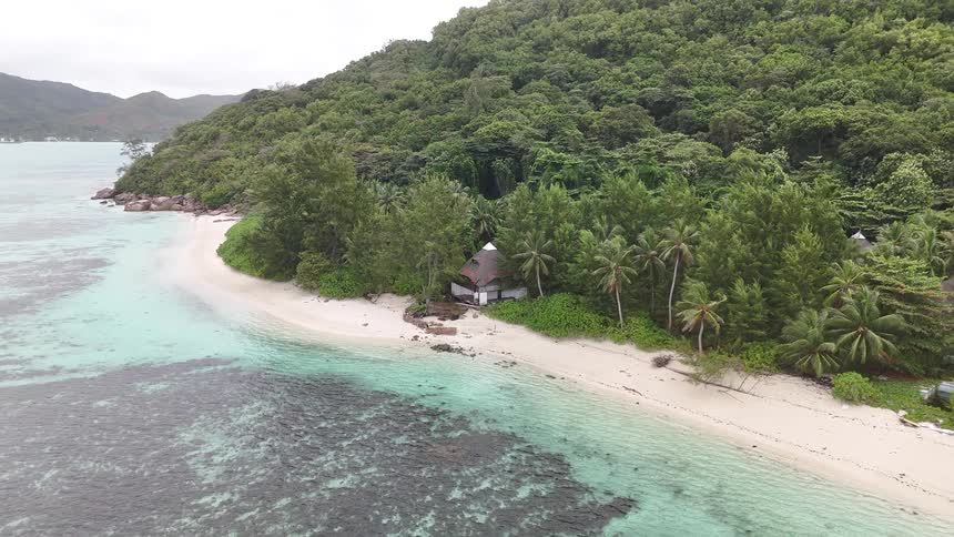 House on a tropical island by the turquoise sea