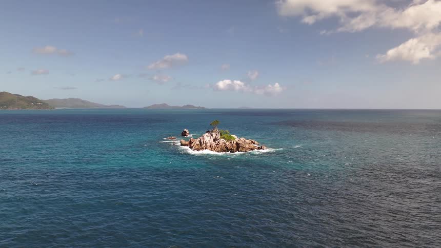 Aerial landscape of a small island in the middle of the ocean