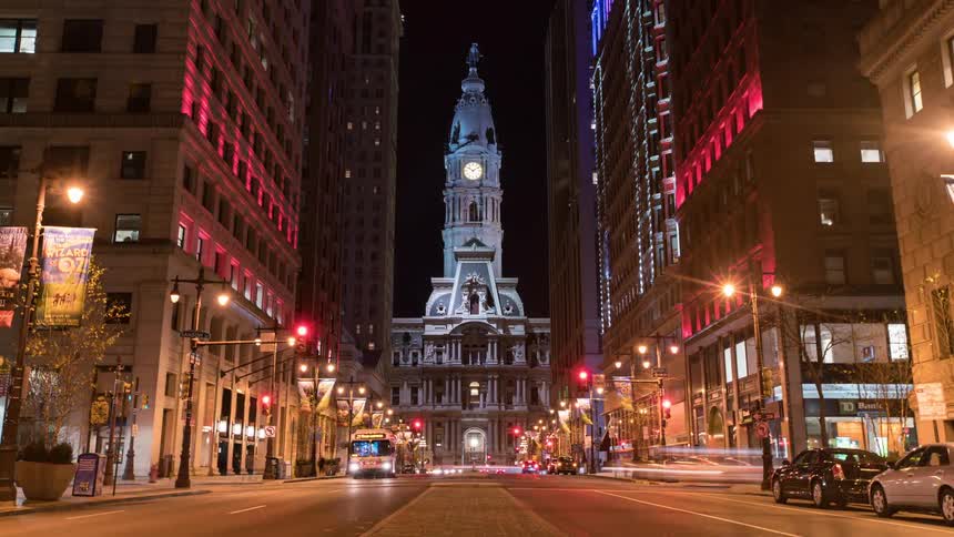 Steady traffic moves in the city at night