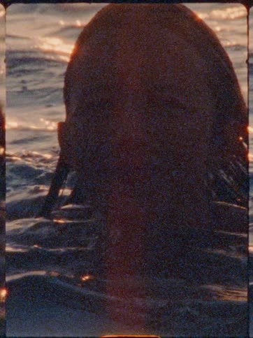 Happy woman swimming in the ocean