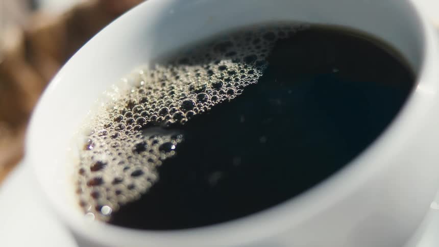 Close up of a white mug with coffee