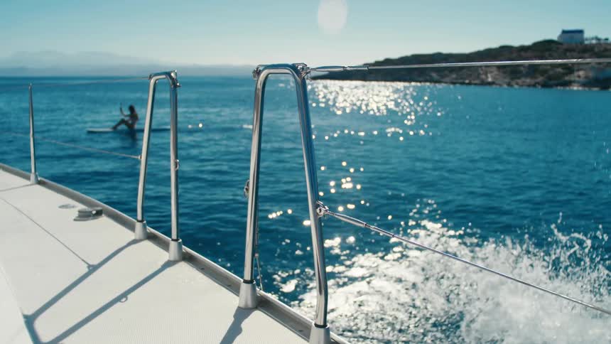Man jumping into the sea from a yacht