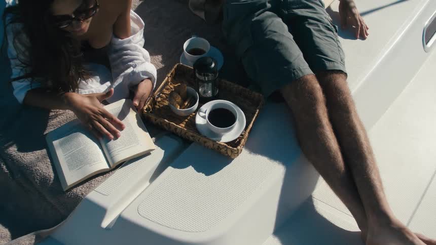 A man is resting while a woman reads