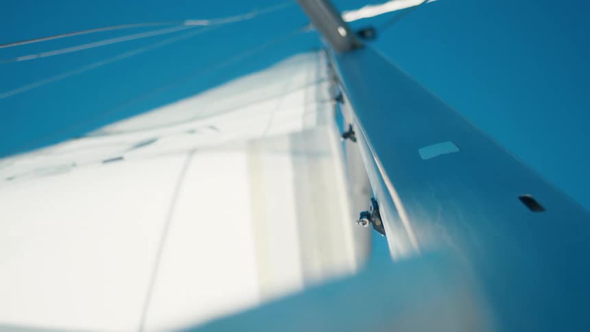 White wind support flag rising on a yacht