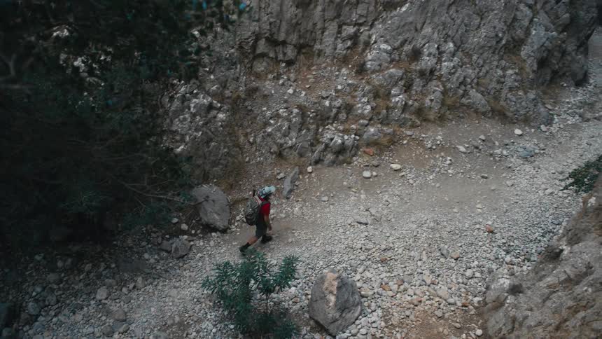 Person walking and hiking in a rocky area