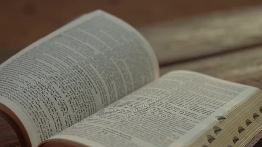 Wind blows the pages of the book