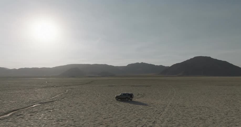 The vehicle travels on the long desert
