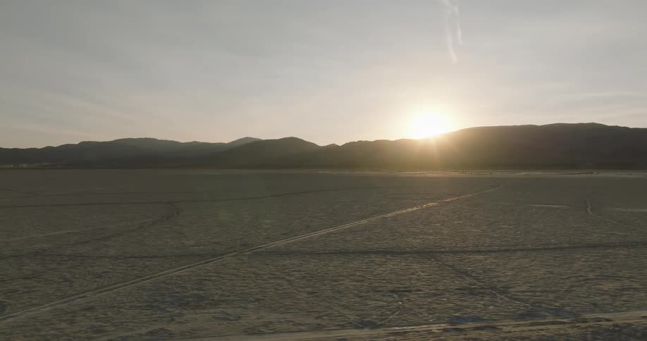 The sun is rising behind the mountains