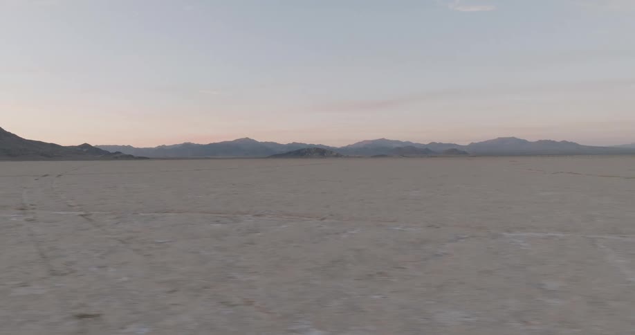 Dry terrain environment with silhouettes of mountains on the horizon