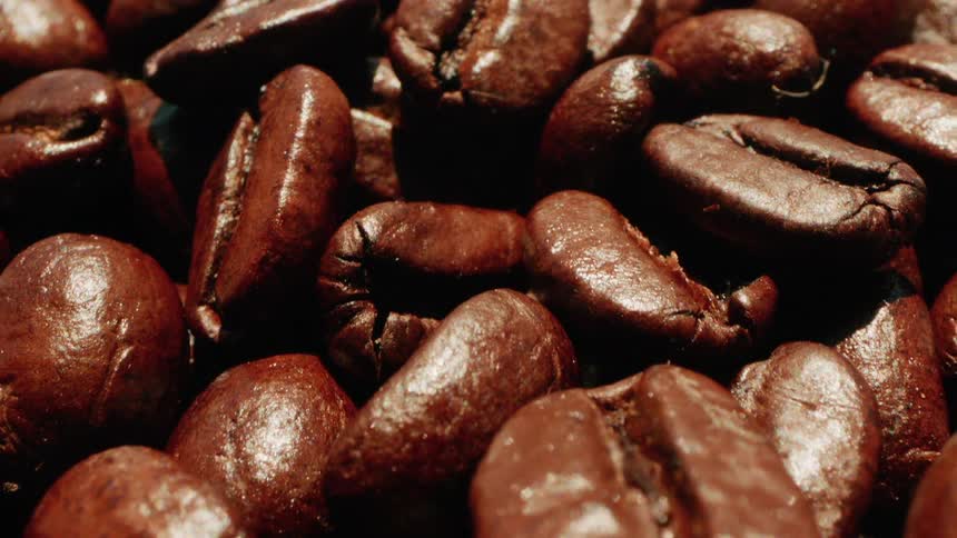 Coffee beans are set out to dry under the sun