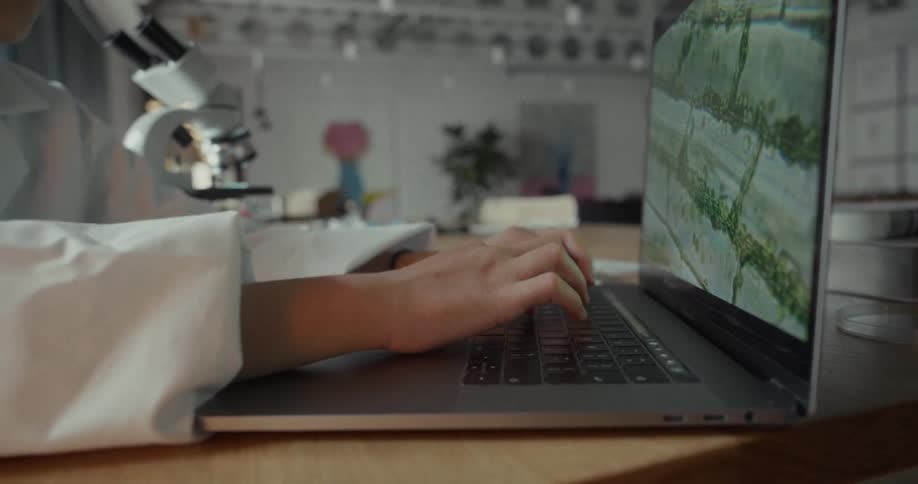Pair of hands typing on laptop