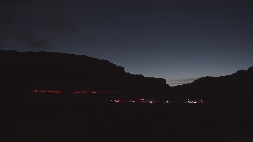 Cars driving past at night