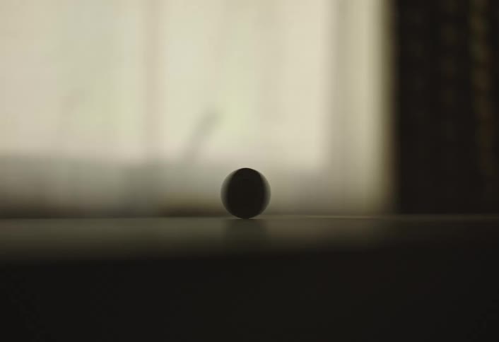 Coin spinning on a table
