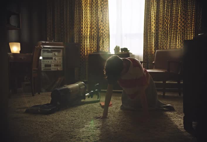Boy kneeling on a mat stretching his body