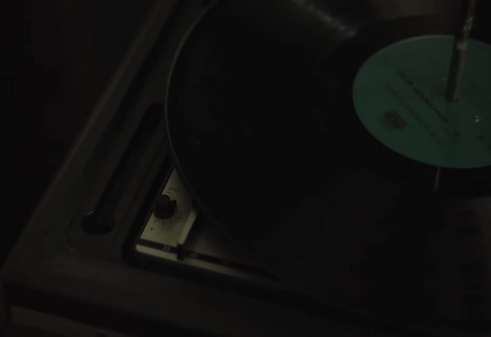 Vinyl record spinning on an old music player