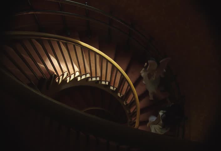 Two children running up the stairs