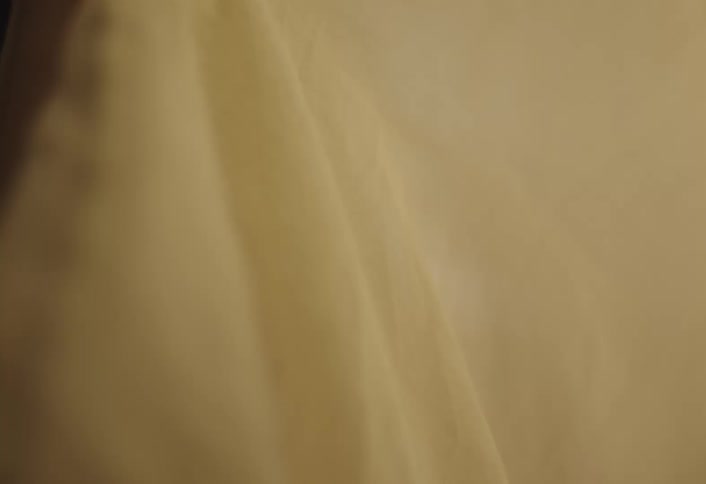 Boy smelling a piece of clothing