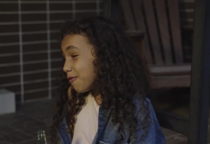 Children drink soda and talk outside