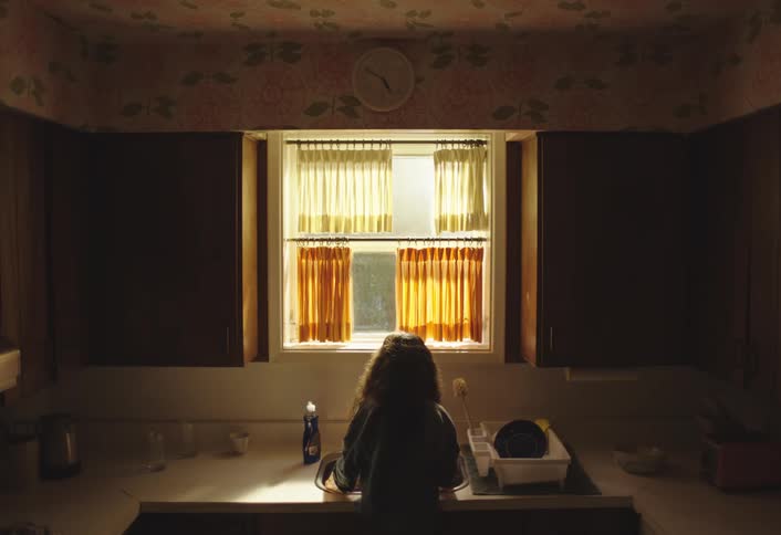 Child washing dishes