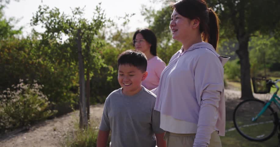 Family with happy expression on a mountain with bicycles in the background