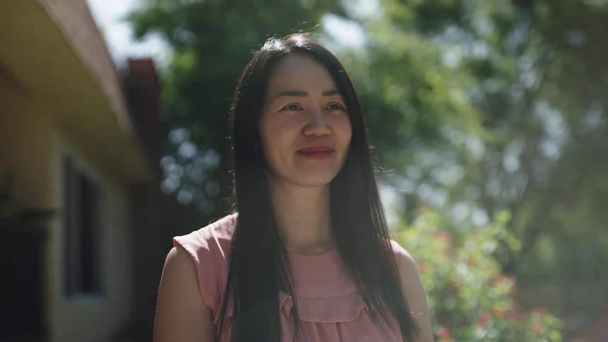 Woman outdoors with happy expression